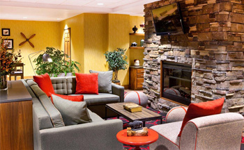 smaller image of Minot lobby with red cushions seating area